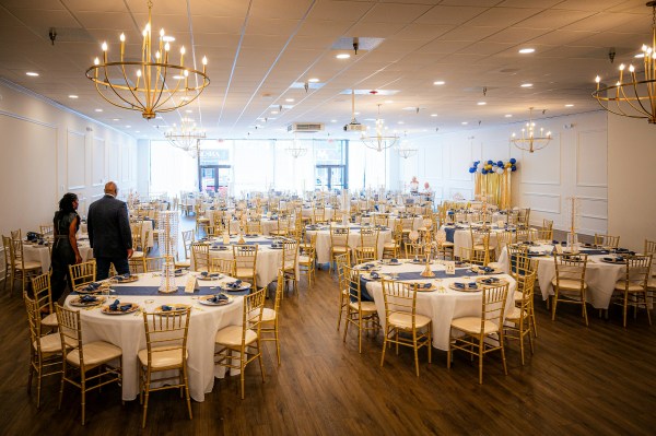 Corporate gala banquet hall with formal tables
