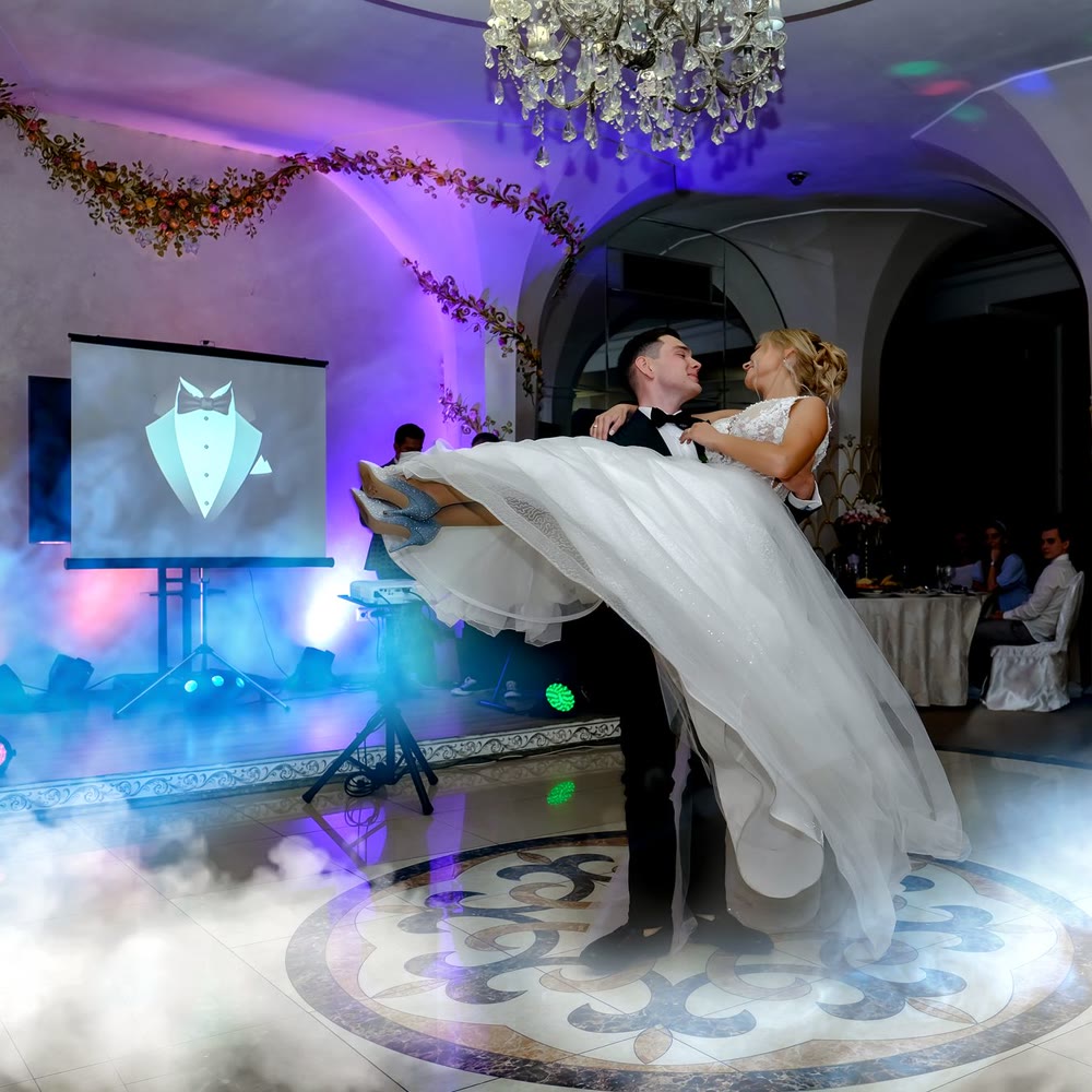 Couple dancing on a low cloud of fog