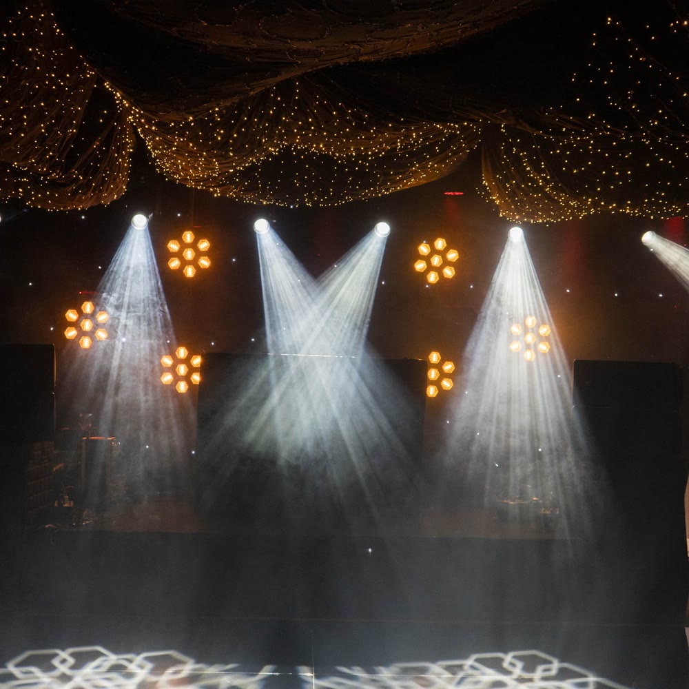 Light beams made visible by haze at an event