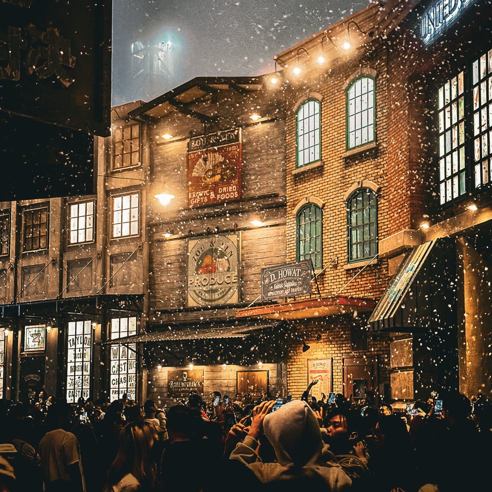 Snowfall effect over guests at a night event