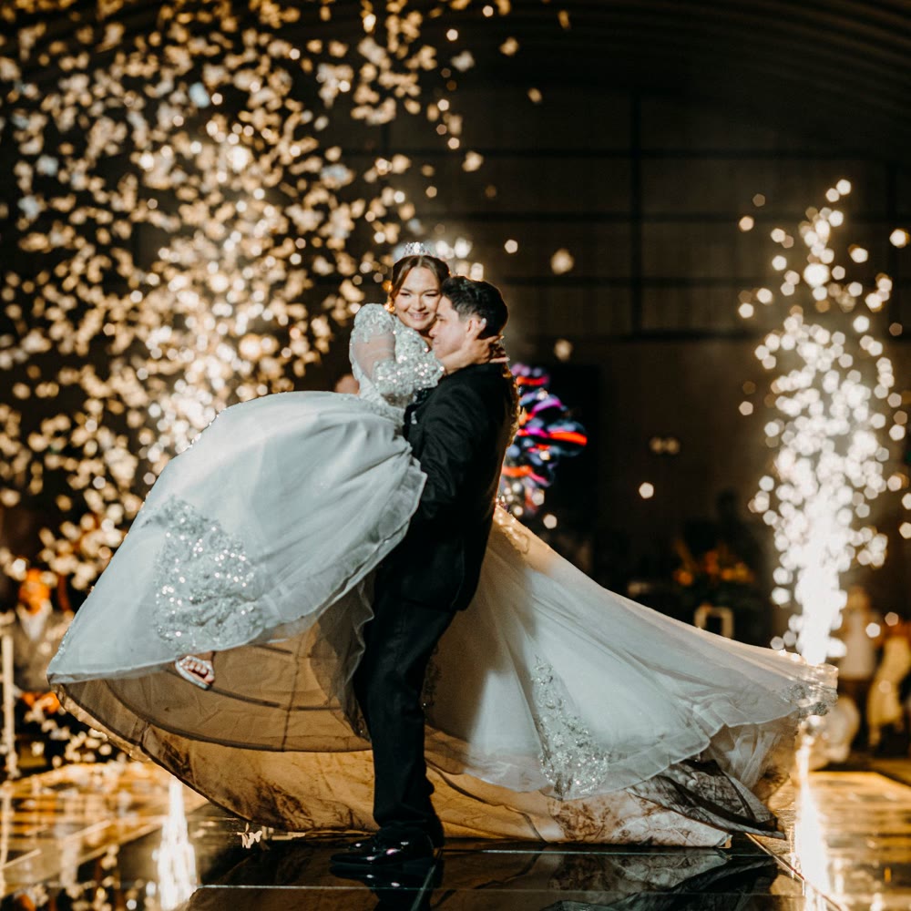 Couple dancing between cold spark fountains