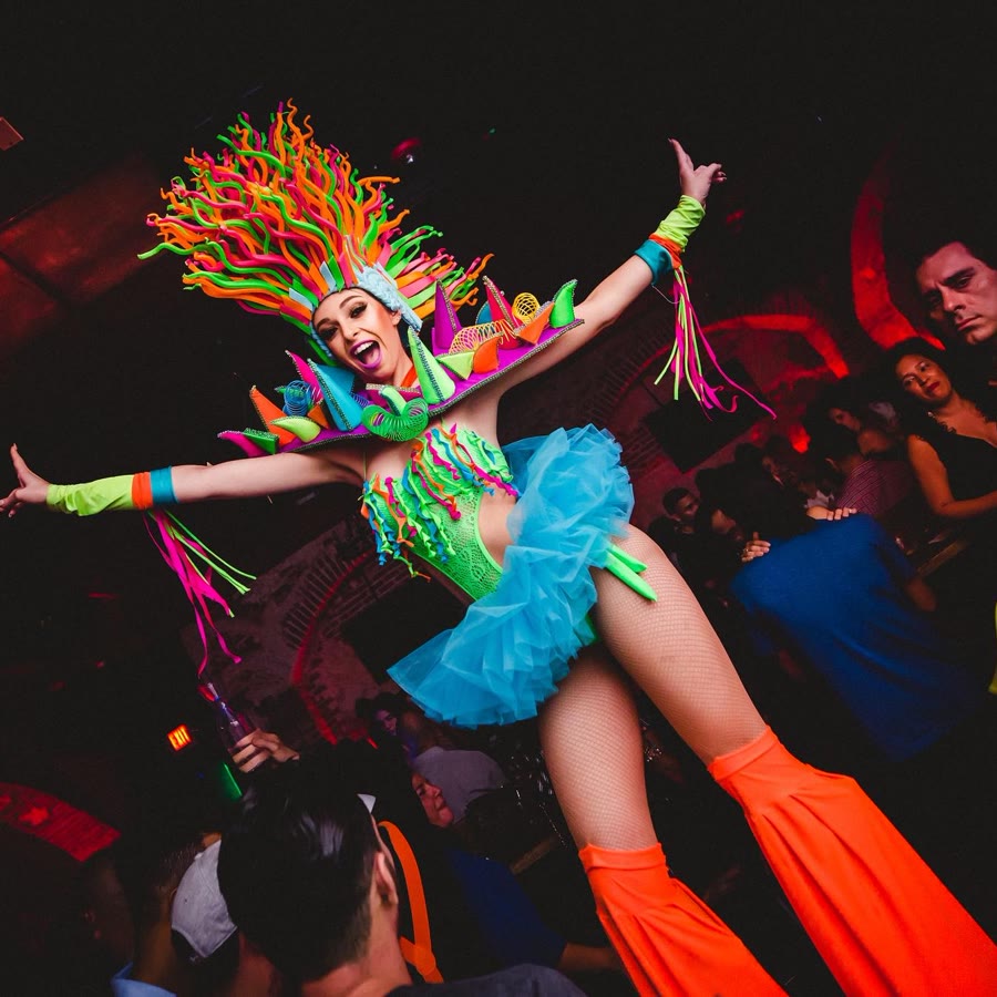 Colorful stilt walker performing in the crowd
